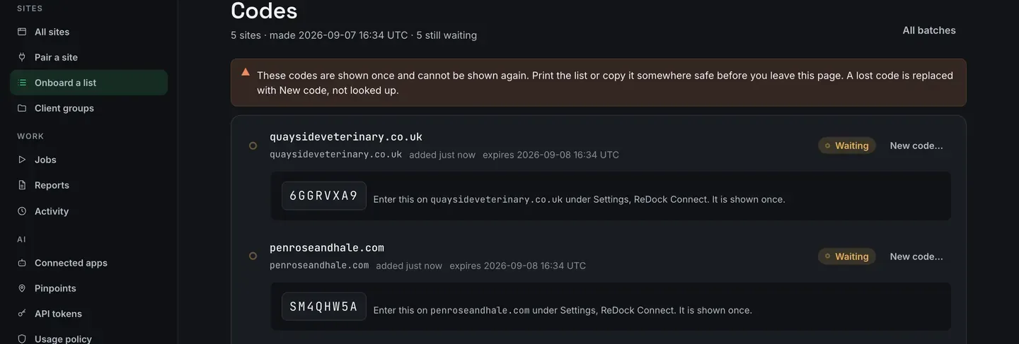 The Codes page. A warning strip says these codes are shown once and cannot be shown again. Under it, each site has a large monospace code such as 6GGRVXA9 and a line saying to enter it on that site under Settings, ReDock Connect.
